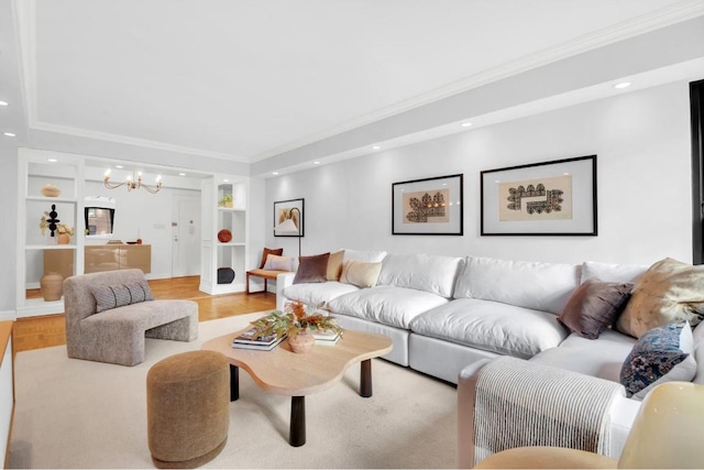 living room featuring crown molding and a notable chandelier