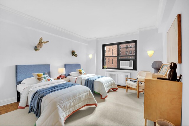 bedroom with parquet floors, ornamental molding, and radiator heating unit