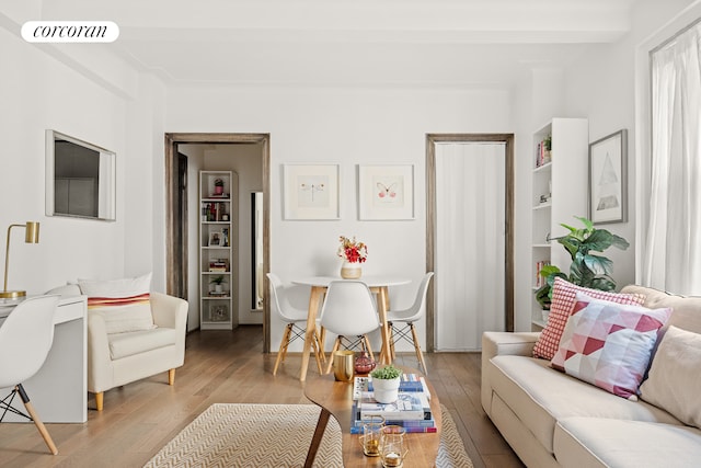 living area featuring light wood-type flooring and visible vents