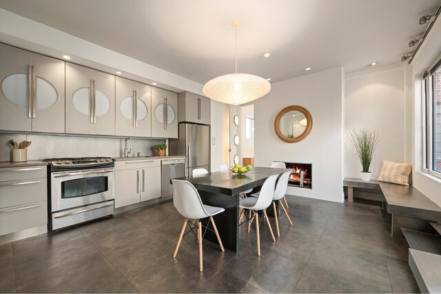 dining room featuring sink and a healthy amount of sunlight