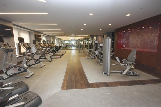 workout area with wood finished floors