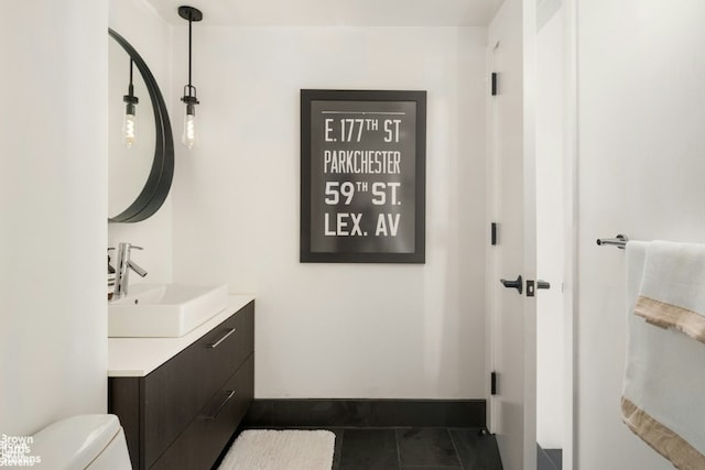 bathroom with tile patterned floors, vanity, and toilet