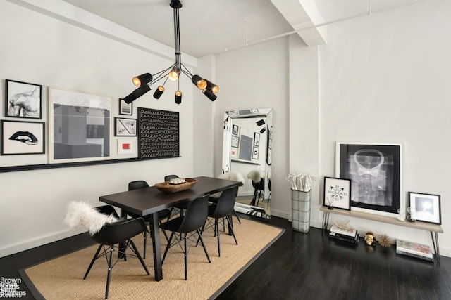 dining area featuring hardwood / wood-style flooring and a notable chandelier