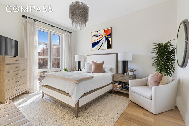 bedroom with light wood-style flooring