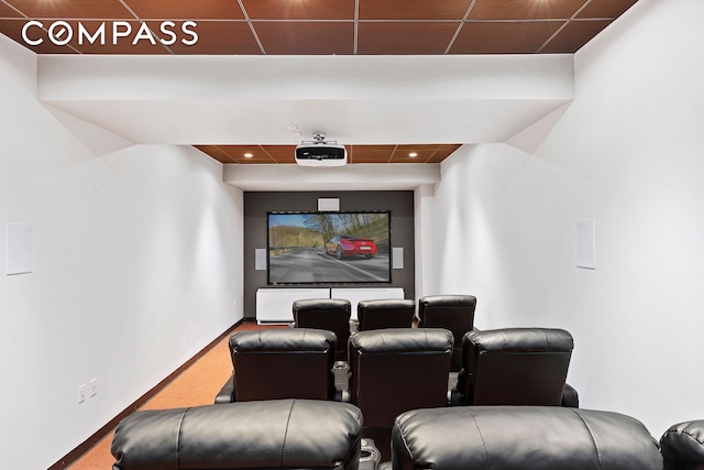 home theater room featuring baseboards and carpet floors