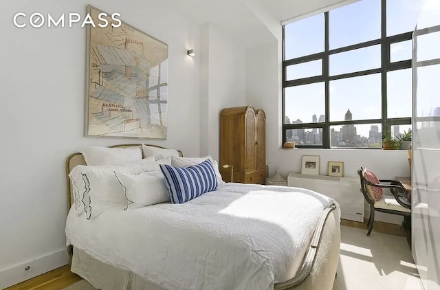 360 Furman St Unit 815, New York City, NY 11201 - bedroom featuring multiple windows and baseboards