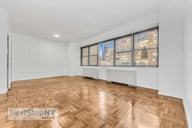 empty room with light parquet flooring