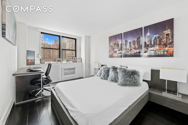 bedroom featuring hardwood / wood-style floors