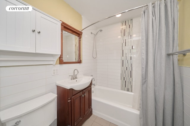 full bathroom with toilet, tile walls, vanity, shower / bath combo with shower curtain, and tile patterned flooring