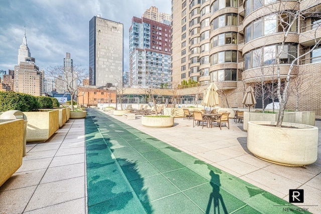 view of community with a city view and a patio