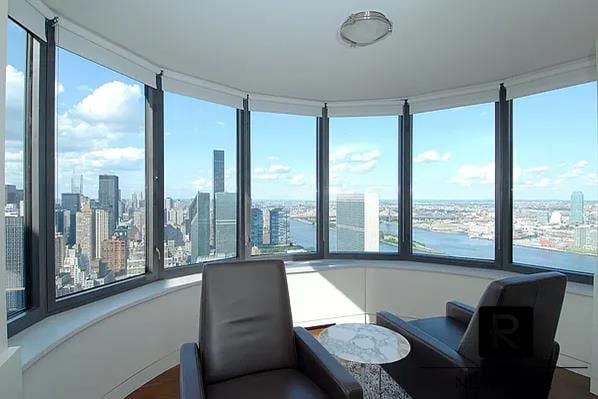 sunroom featuring a view of city