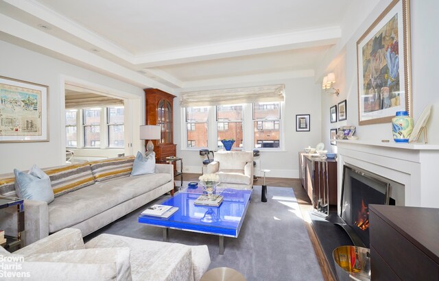 living room featuring ornamental molding, dark hardwood / wood-style floors, and beam ceiling