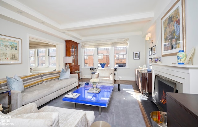 living area with a warm lit fireplace, baseboards, dark wood-style floors, crown molding, and beam ceiling