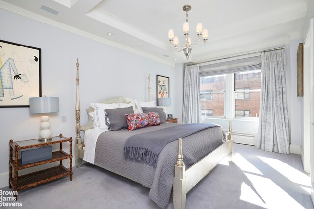 bedroom featuring an inviting chandelier, a tray ceiling, carpet floors, and crown molding