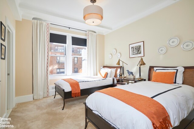 bedroom featuring light colored carpet