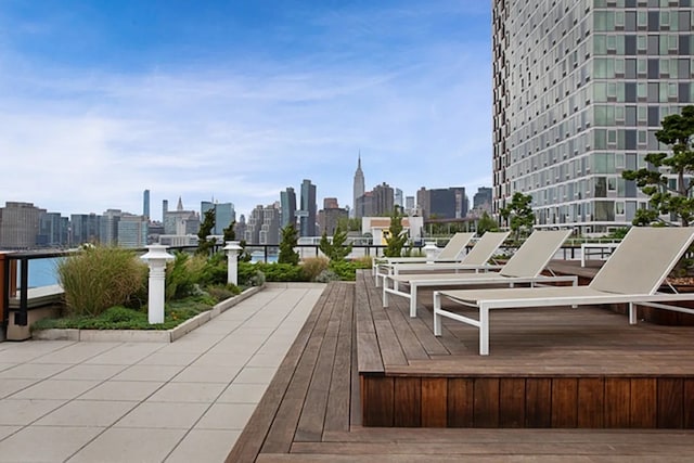 2-17 51st Ave Unit 902, New York City, NY 11101 - wooden deck with a view of skyline