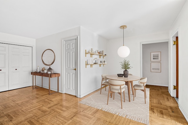 dining space featuring baseboards