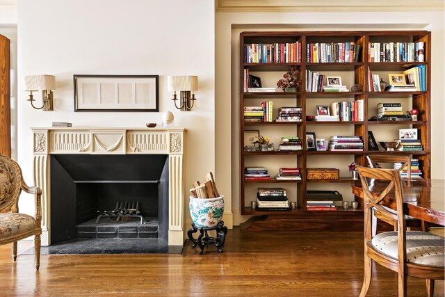 sitting room with wood-type flooring