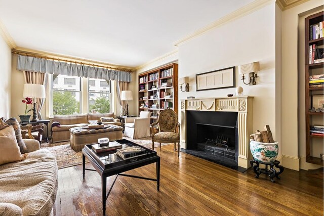 living room with ornamental molding and wood-type flooring