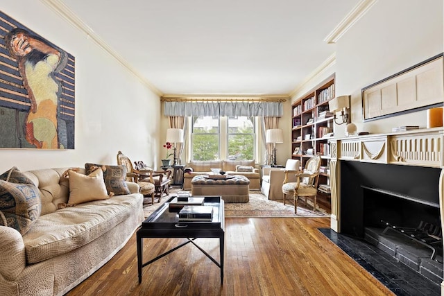 living room with hardwood / wood-style floors and ornamental molding