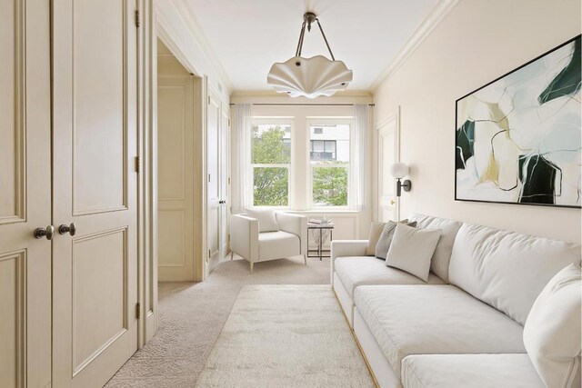 living area with crown molding and light colored carpet