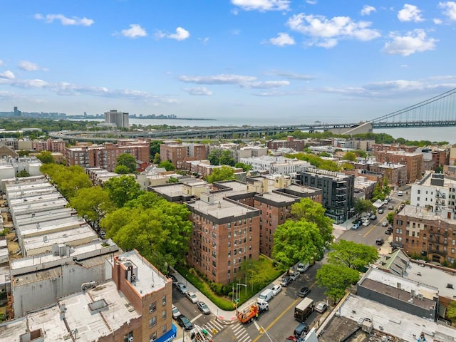 birds eye view of property with a view of city and a water view