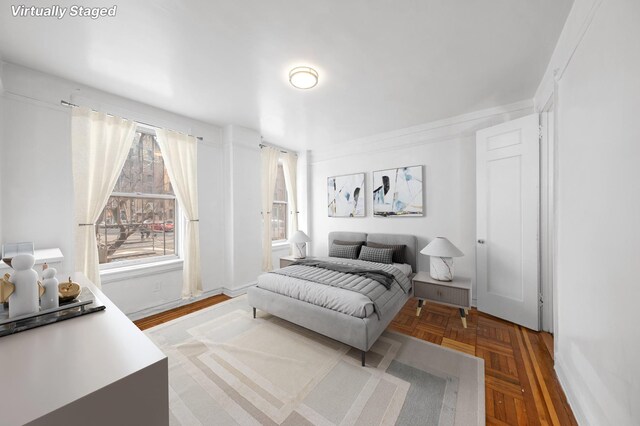 bedroom featuring parquet floors