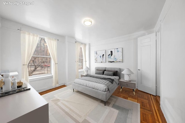 bedroom featuring baseboards