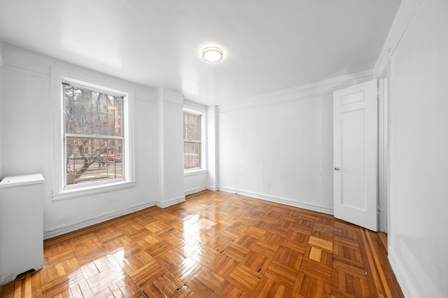 empty room with baseboards