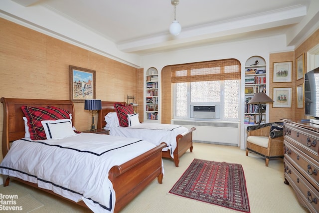 bedroom with cooling unit, radiator heating unit, ornamental molding, light carpet, and beamed ceiling