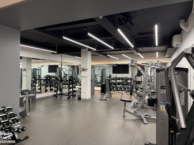 workout area featuring a wall mounted AC