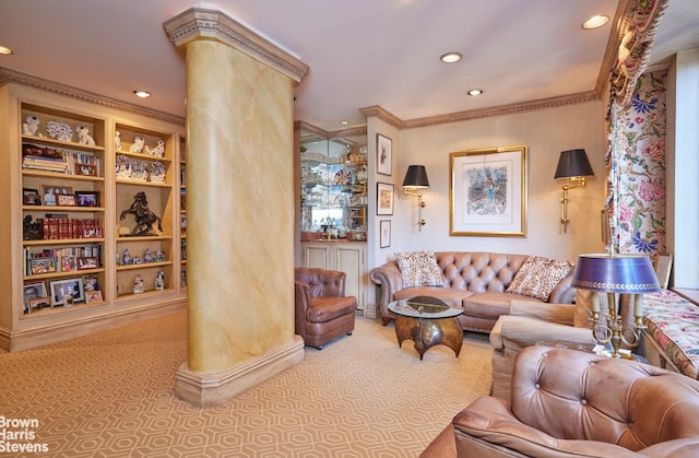 carpeted living room featuring crown molding, built in features, and ornate columns