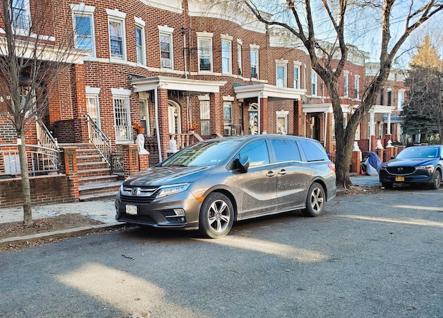 21 Charlotte St, New York City, NY 11385 - view of front of home featuring brick siding