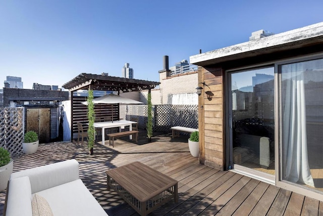 wooden terrace with a view of city and a pergola