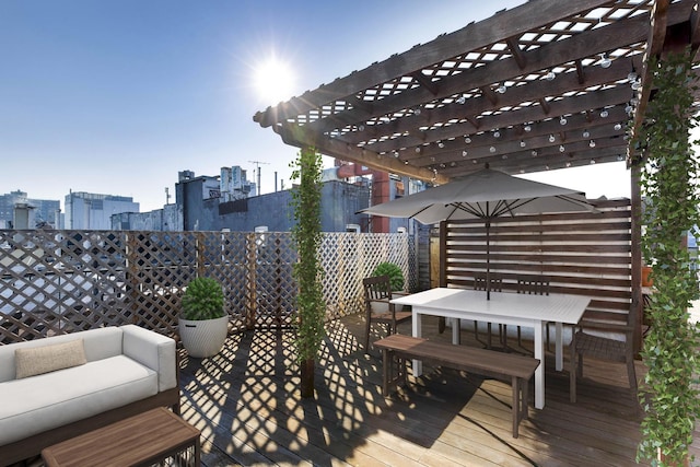 236 E 6th St Unit 5E, New York City, NY 10003 - deck featuring a city view, a pergola, and outdoor dining space