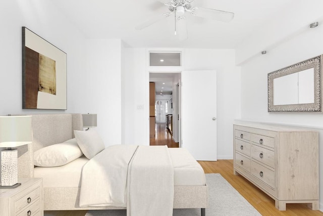 bedroom featuring a ceiling fan and light wood-type flooring