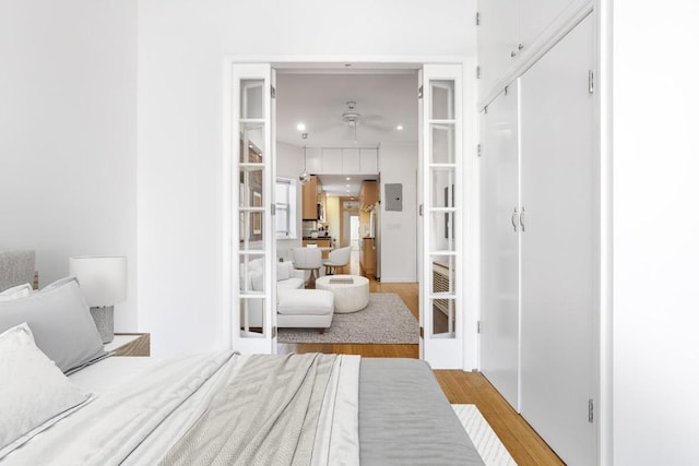 bedroom with wood finished floors and recessed lighting