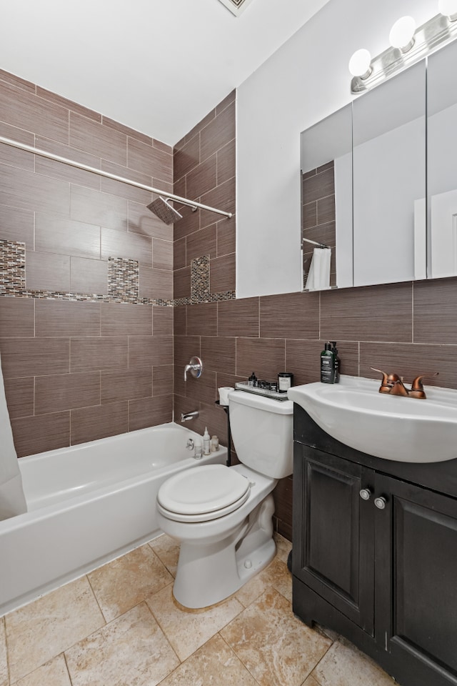 bathroom with toilet, tile walls, vanity, and shower / bathtub combination with curtain