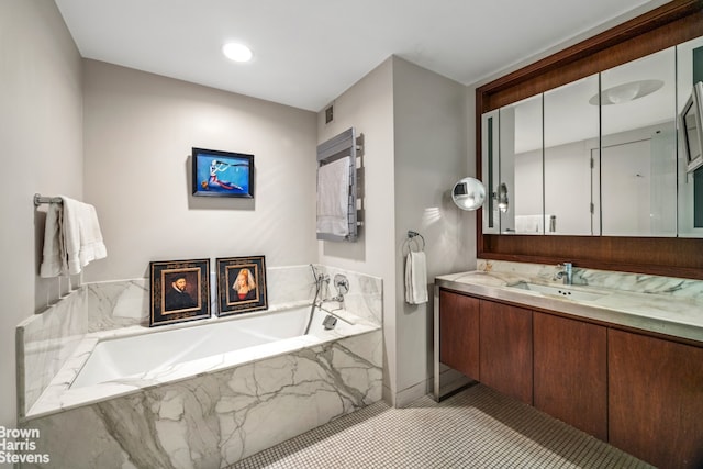 bathroom featuring tile patterned floors, visible vents, vanity, and a bath