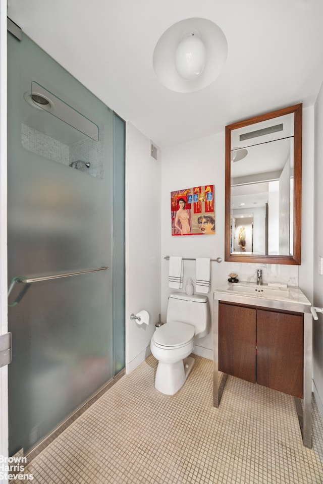 full bathroom with tile patterned flooring, a shower with door, toilet, vanity, and visible vents