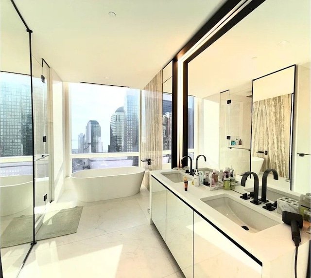 bathroom featuring vanity, tile patterned floors, and independent shower and bath