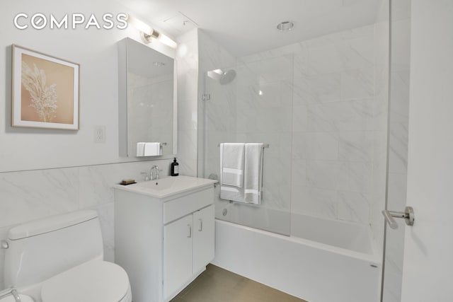 171 W 131st St Unit 304, New York City, NY 10027 - bathroom featuring vanity, shower / bathtub combination, and tile walls