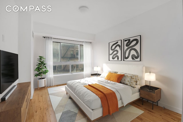 171 W 131st St Unit 304, New York City, NY 10027 - bedroom with light wood-style flooring and baseboards