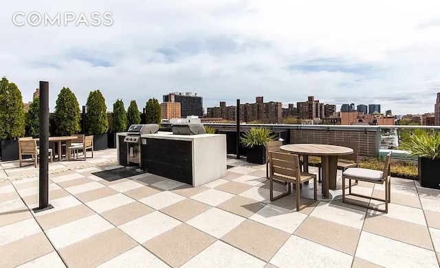 171 W 131st St Unit 304, New York City, NY 10027 - view of patio / terrace featuring outdoor dining area, a view of skyline, and area for grilling
