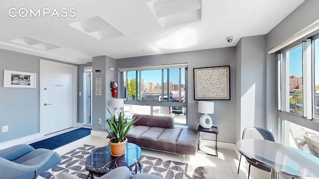 171 W 131st St Unit 304, New York City, NY 10027 - living area featuring healthy amount of natural light and tile patterned floors