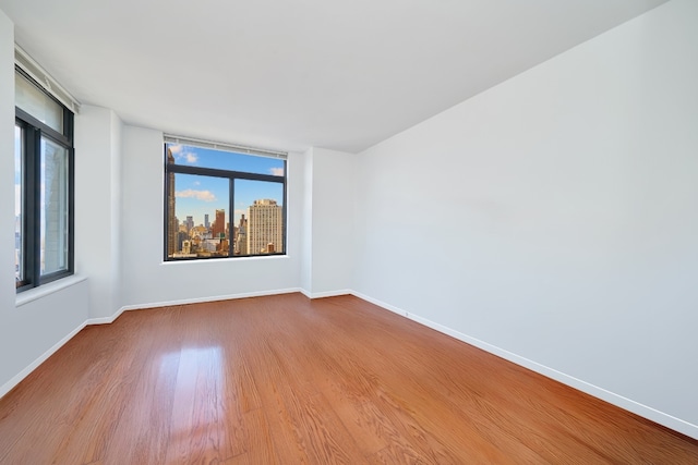 empty room featuring hardwood / wood-style floors