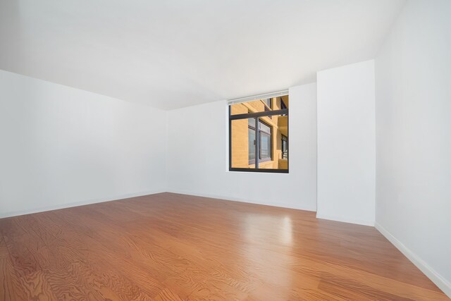 spare room featuring light wood-type flooring