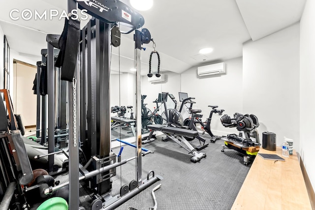 exercise room featuring an AC wall unit