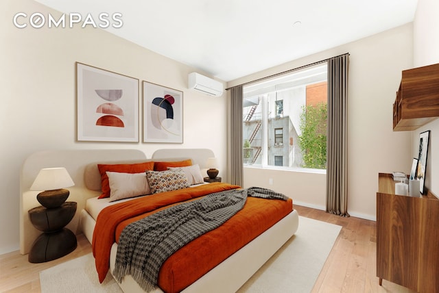 bedroom with light wood-type flooring and a wall mounted air conditioner