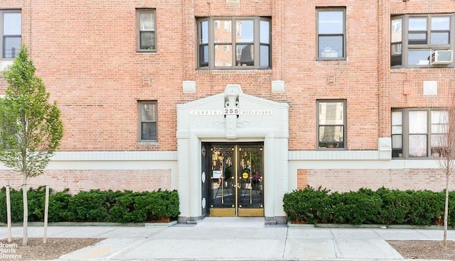 entrance to property with brick siding and french doors